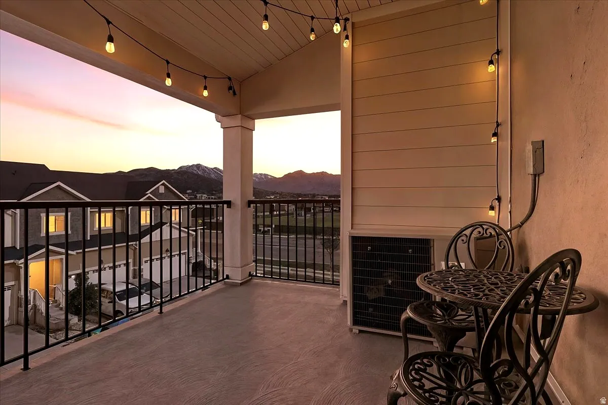 The covered balcony at sunset, looking west over the valley toward the mountains